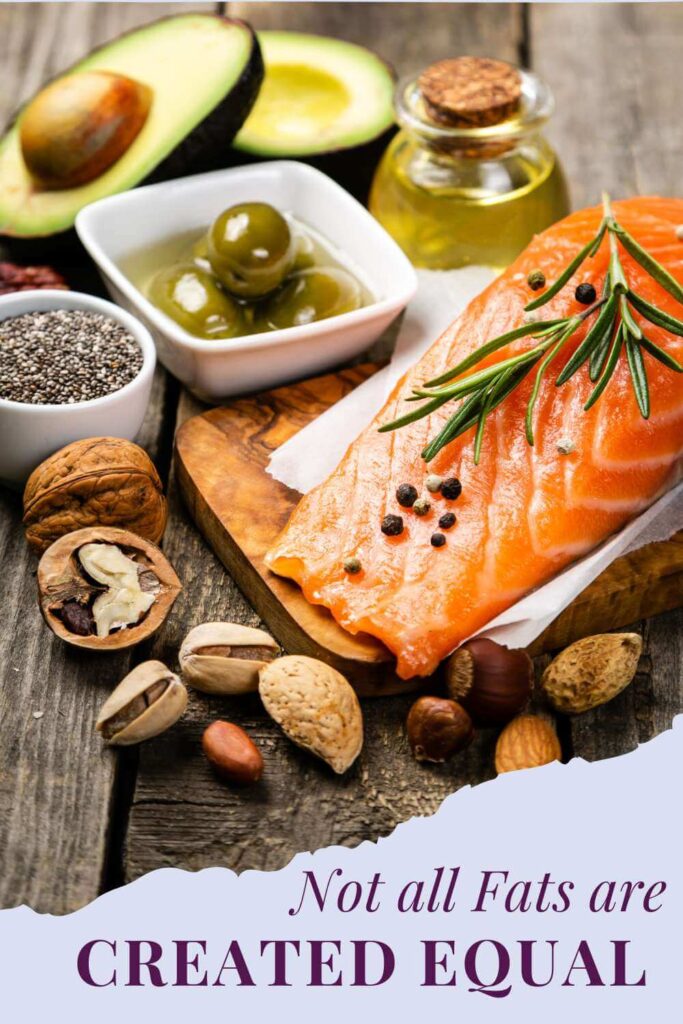 A picture of different sources of fats including salmon, olive oil, olives, and nuts 